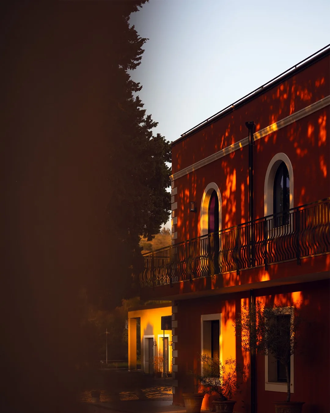 The villa lit after sunset